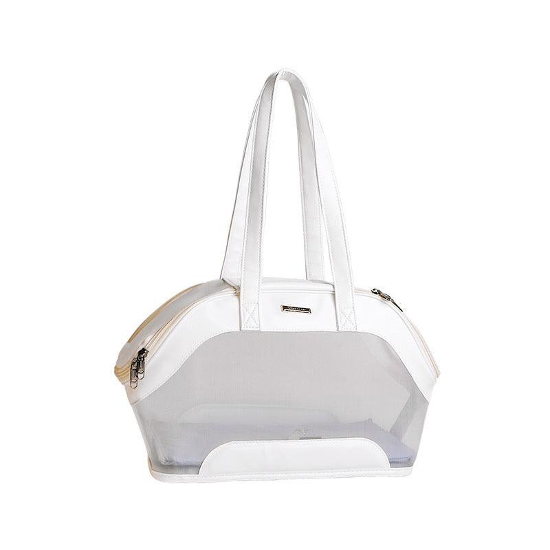 White mesh pet carrier with white accents on a white background