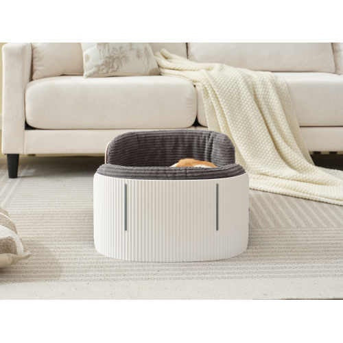 side view white and brown dog sleeping in scandanavian style gray dog bed
