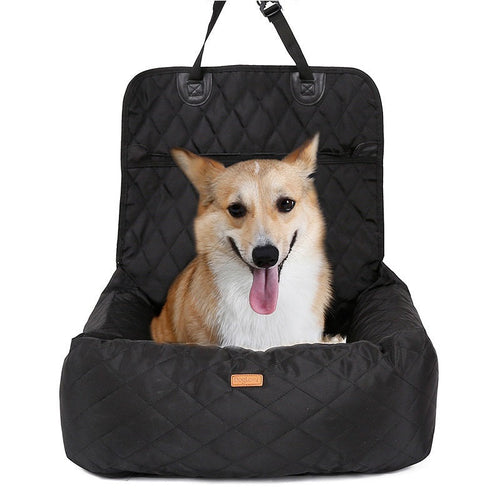 Brown and white dog sitting in a fluffy dog car carrier seat