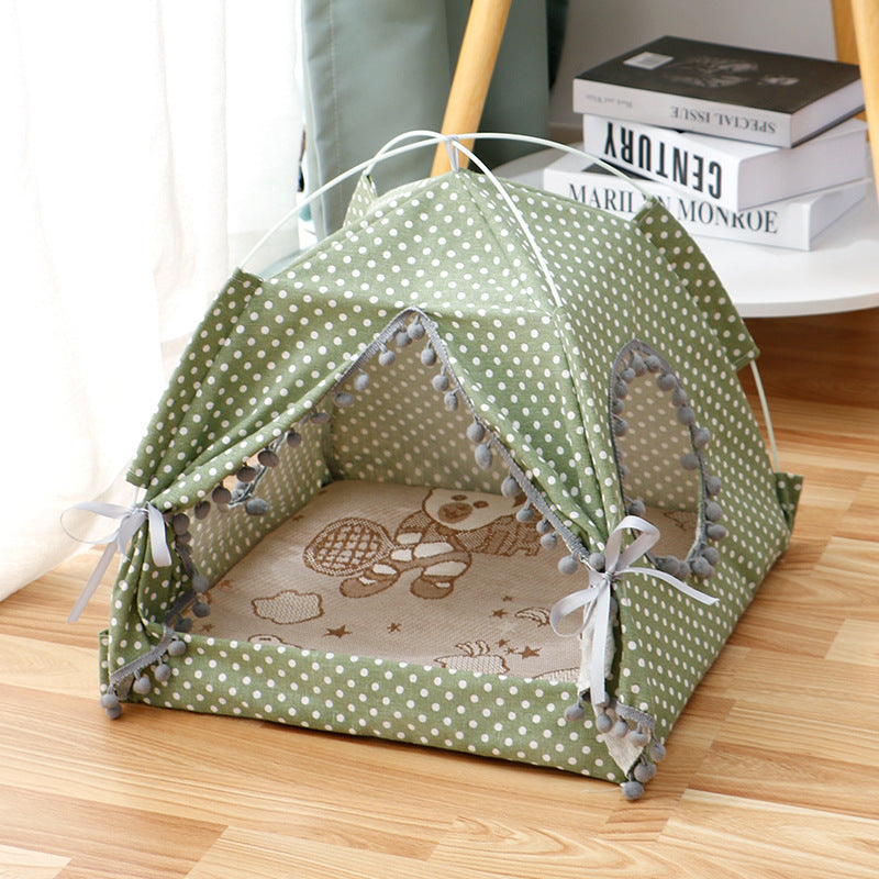 Green polka dot cat tent with beige inner bed