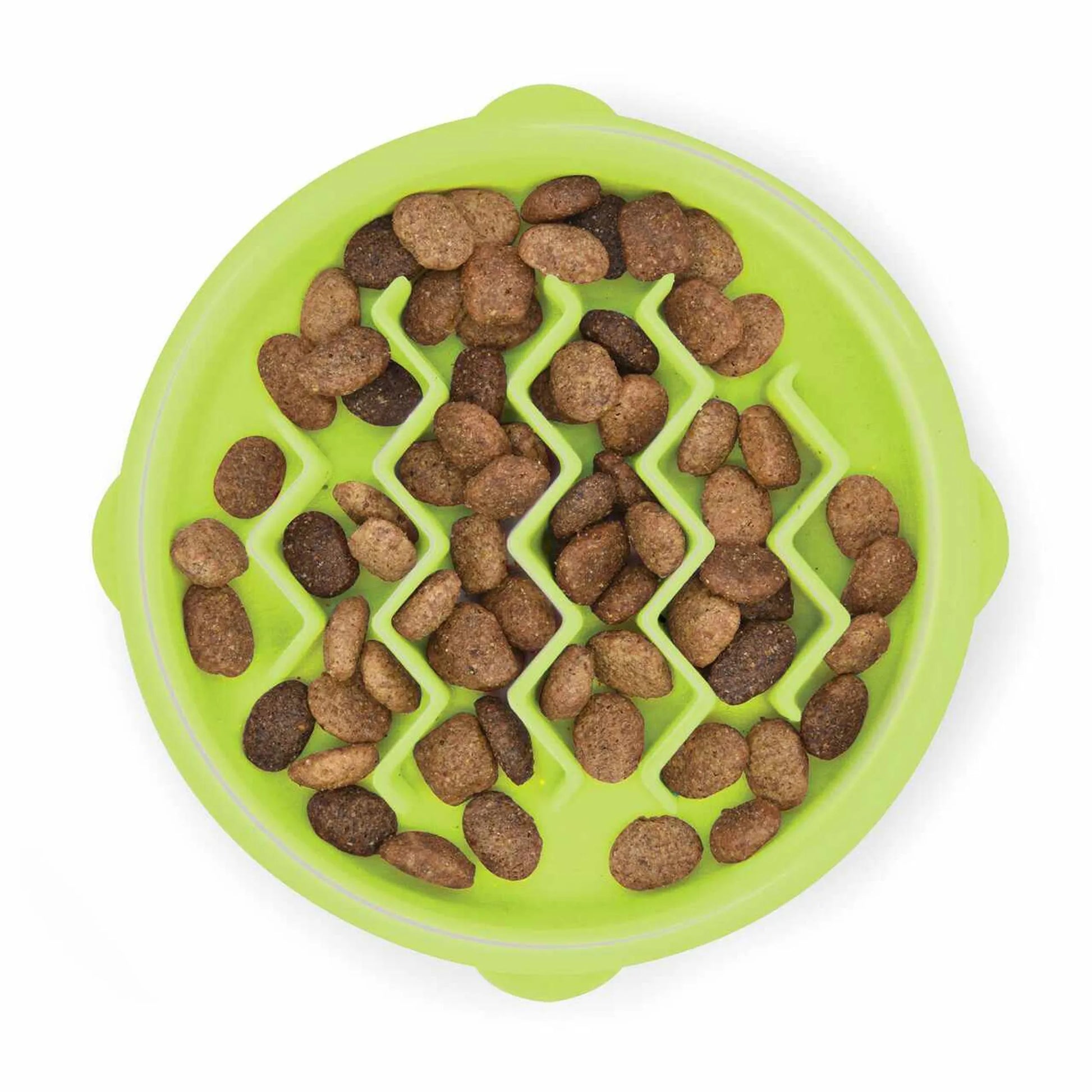 Green pet food puzzle bowl with brown kibble on a white background