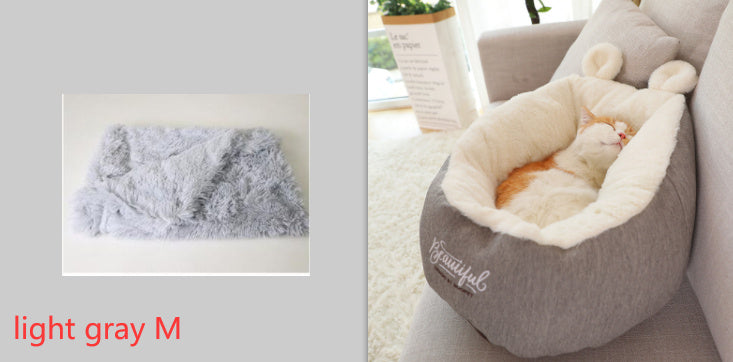 Cat sleeping in pet bed with fabric close up