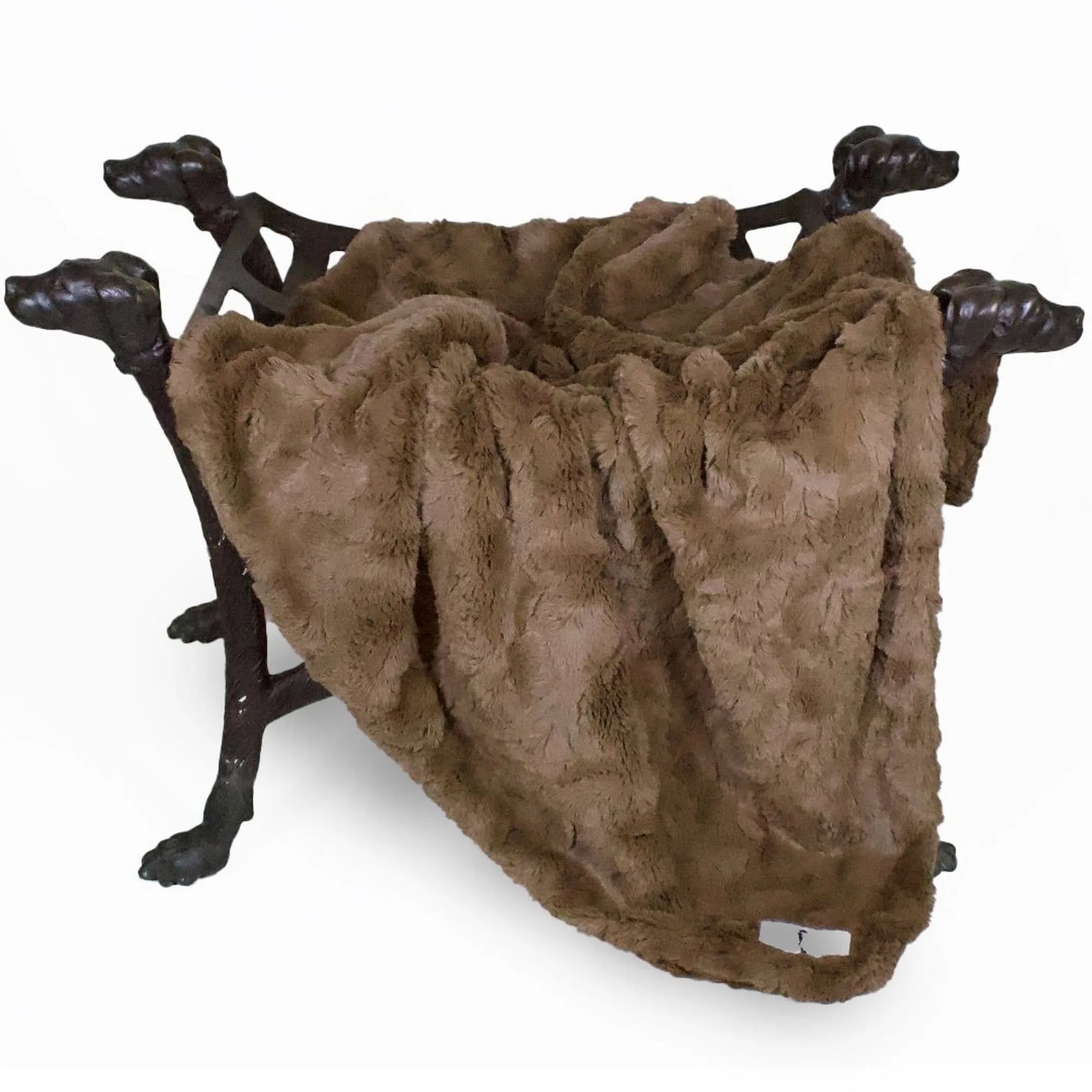 Brown fur throw blanket on a decorative stand with dog handles on a white background
