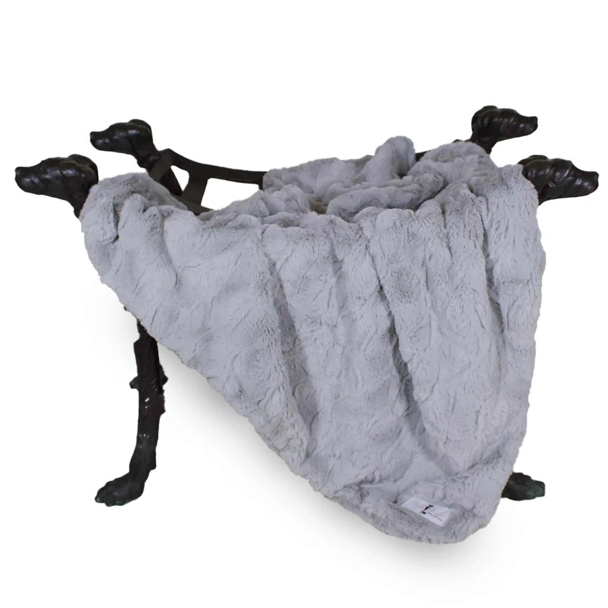 Gray textured blanket draped over a decorative stand with black metal legs on a white background