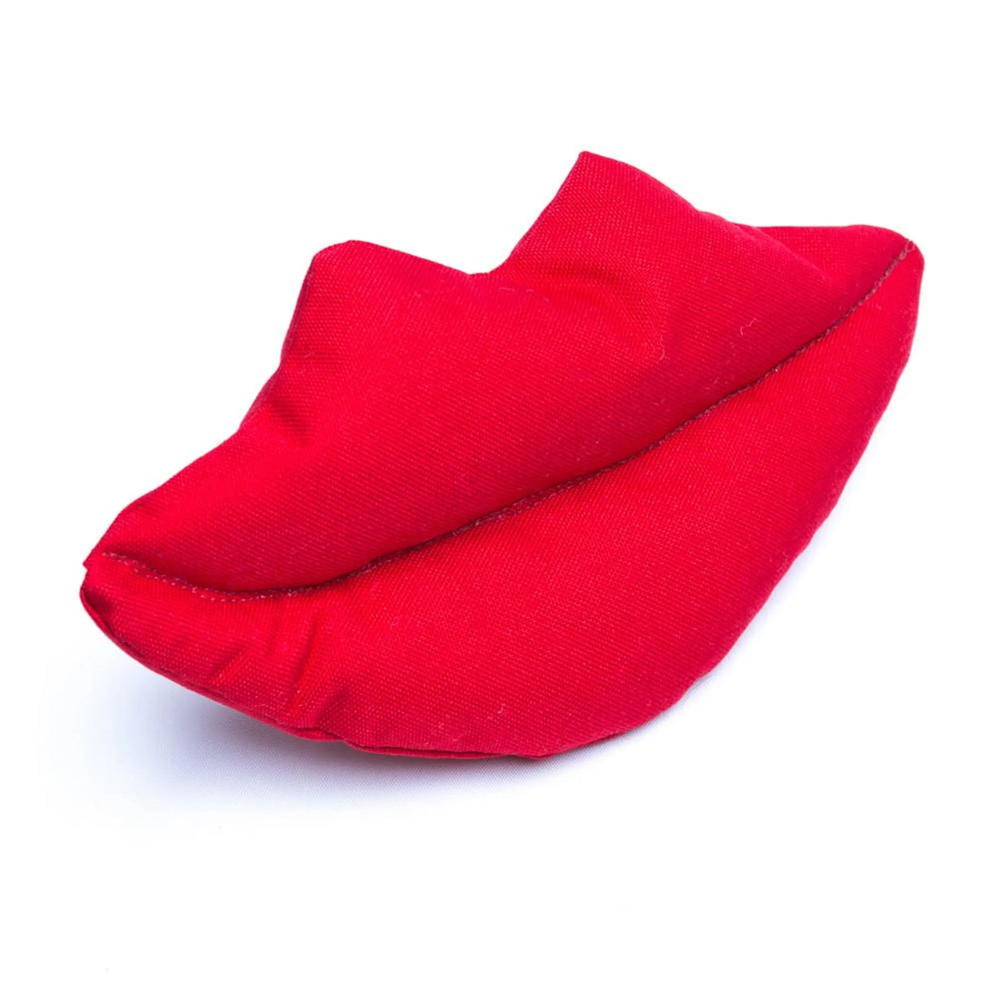 Red fabric lip dog toy on a white background