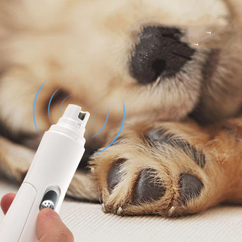 White electric vibrating clipper and dog paw